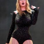 Taylσr Swift Shines In Glamorous Black Beaded Dress in Show